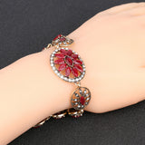 Antique gold plated Turkish Style bracelet 8 in with red resin stones