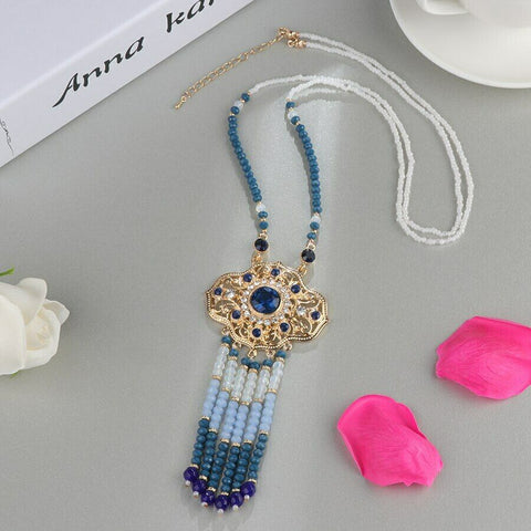 India Style gold color necklace with blue and clear stones and beaded tassels