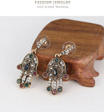 Turkish Style Hand of Fatima necklace and earrings set with red colored  stones