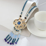 India Style gold color necklace with blue and clear stones and beaded tassels